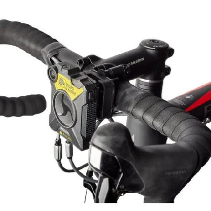 Klick Fast handlebar mount for tube diameter 20mm to 30mm SKU DOCKHBARMOUM — Close-up of black moulded plastic bracket with centrally fitted body cam on bicycle handlebars
