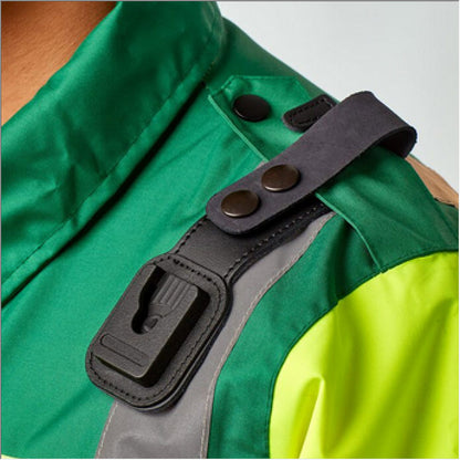 Close-up of a green and yellow jacket epaulette with a black leather loop around it and a klick fast dock below.