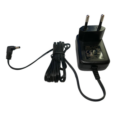 Black power adapter with plug on a white background
