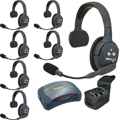 Collection of seven UltraLITE HD single sided wireless headsets and receiver on a white background HUB7S